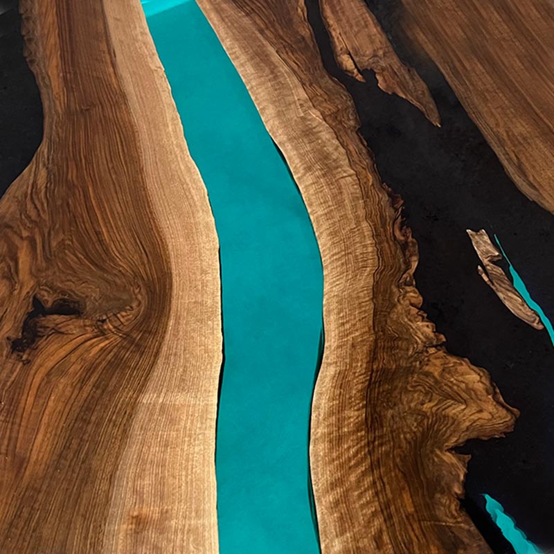 Epoxidharz Couchtisch. Couchtisch Nussbaum rund mit Epoxidharz türkis. Modell Gletschersee