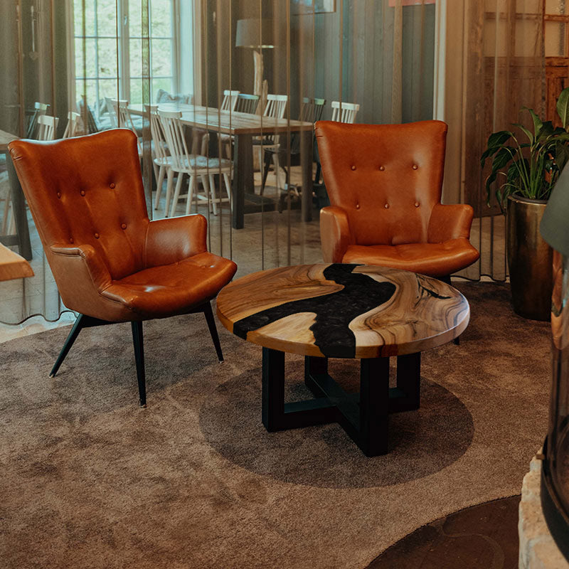 Epoxidharz Couchtisch aus Nussbaum rund in schwarz. Modell Feldsee