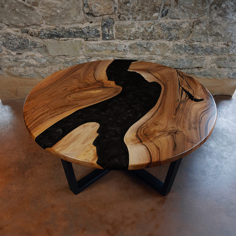 Epoxidharz Couchtisch aus Nussbaum rund in schwarz. Modell Feldsee