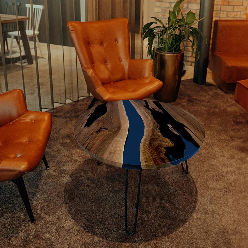 Couchtisch Nussbaum rund mit Epoxidharz maritim blau. Modell Gletschersee