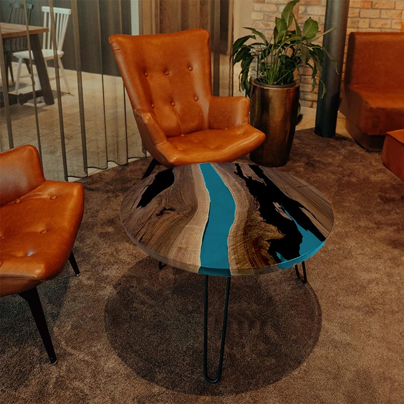 Epoxidharz Couchtisch. Couchtisch Nussbaum rund mit Epoxidharz türkis. Modell Gletschersee