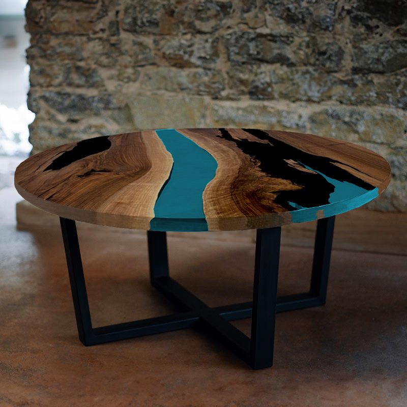 Epoxidharz Couchtisch. Couchtisch Nussbaum rund mit Epoxidharz türkis. Modell Gletschersee