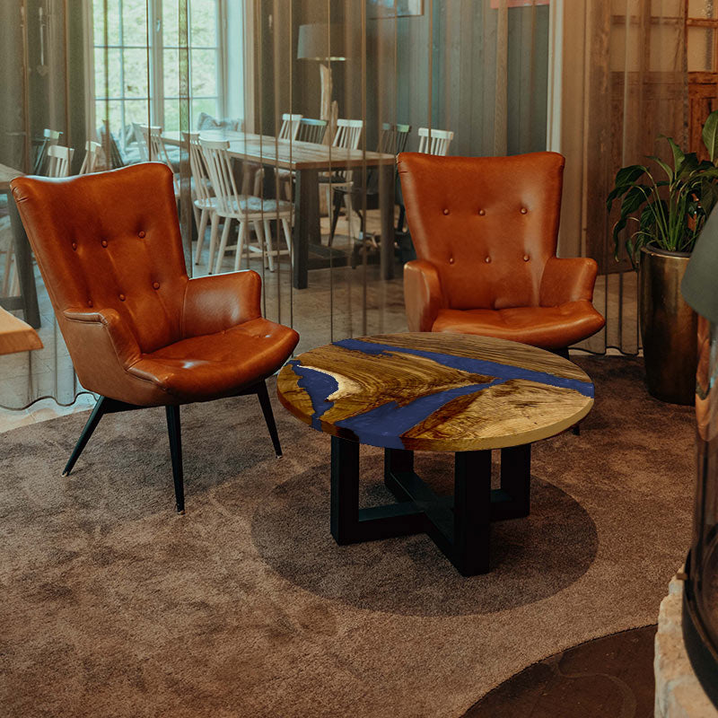 Epoxy Couchtisch. Couchtisch rund mit Epoxidharz blau. Modell Hegauvulkan von schwarzhirsch