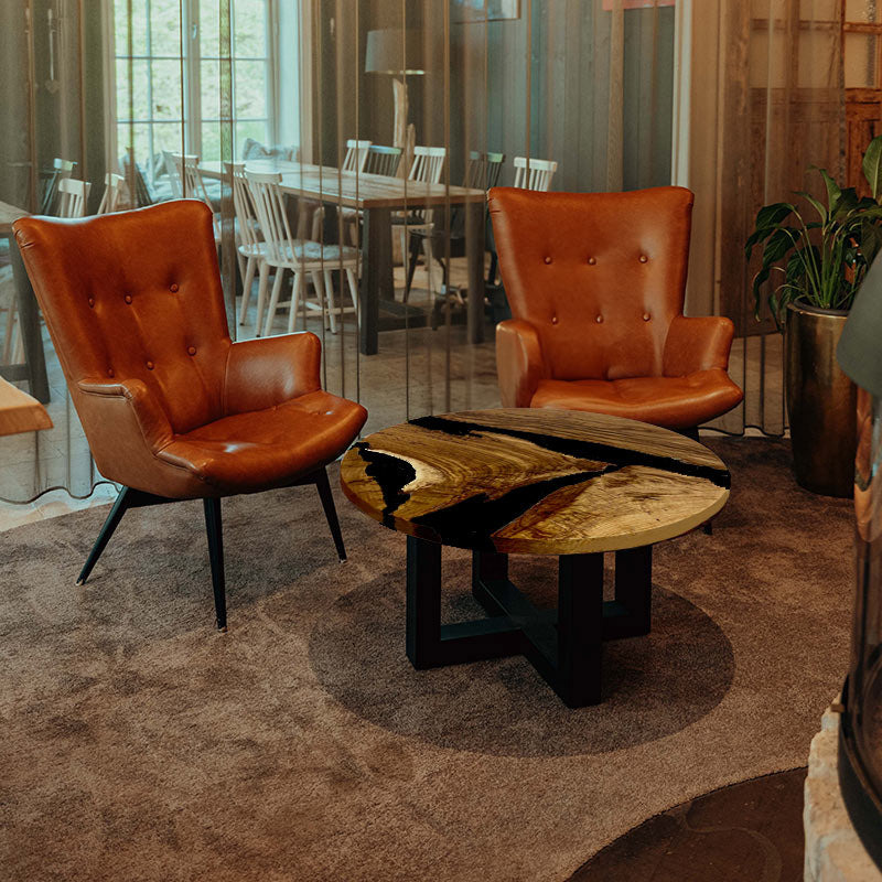 Couchtisch_Epoxidharz. Couchtisch rund mit Epoxidharz schwarz. Modell Hegauvulkan von schwarzhirsch