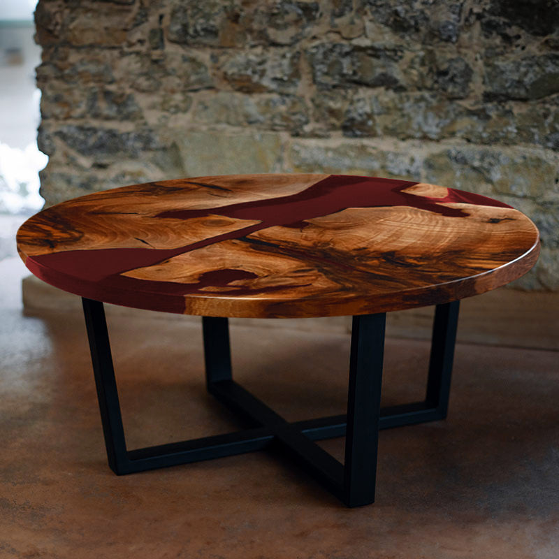 Couchtisch rund aus Nussbaum. Epoxidharz rot. Modell Schluchsee