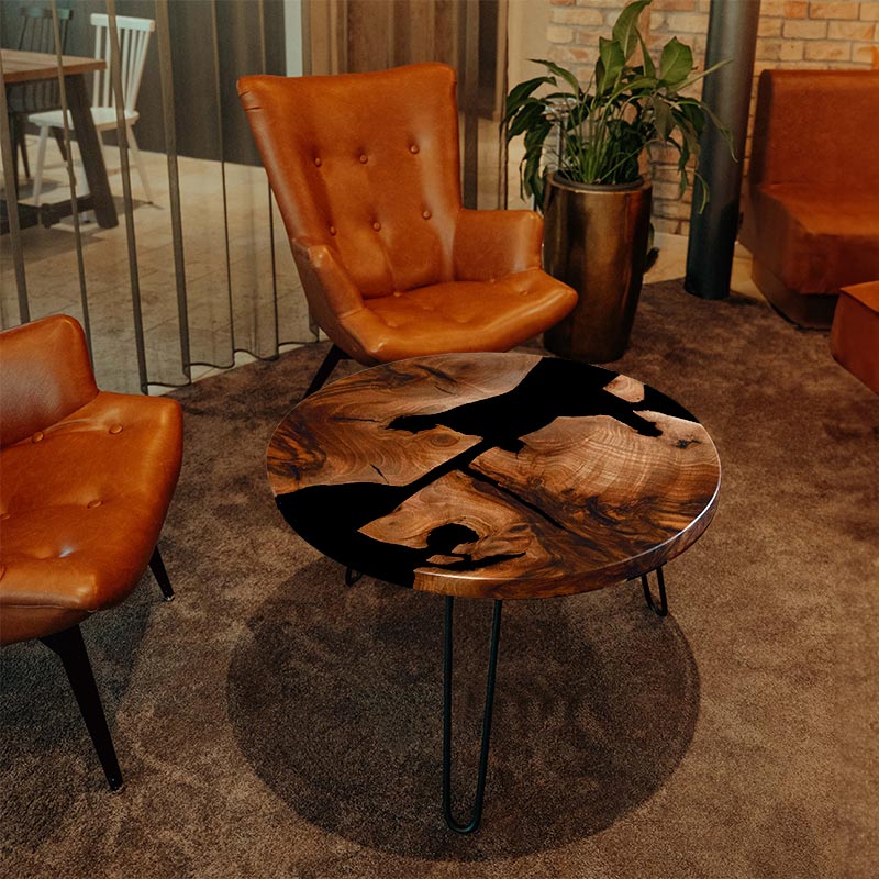 Couchtisch rund aus Nussbaum I Epoxidharz schwarz. Modell Schluchsee