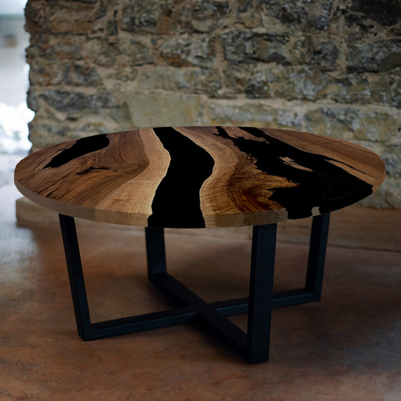 Couchtisch Nussbaum rund mit Epoxidharz schwarz. Modell Gletschersee