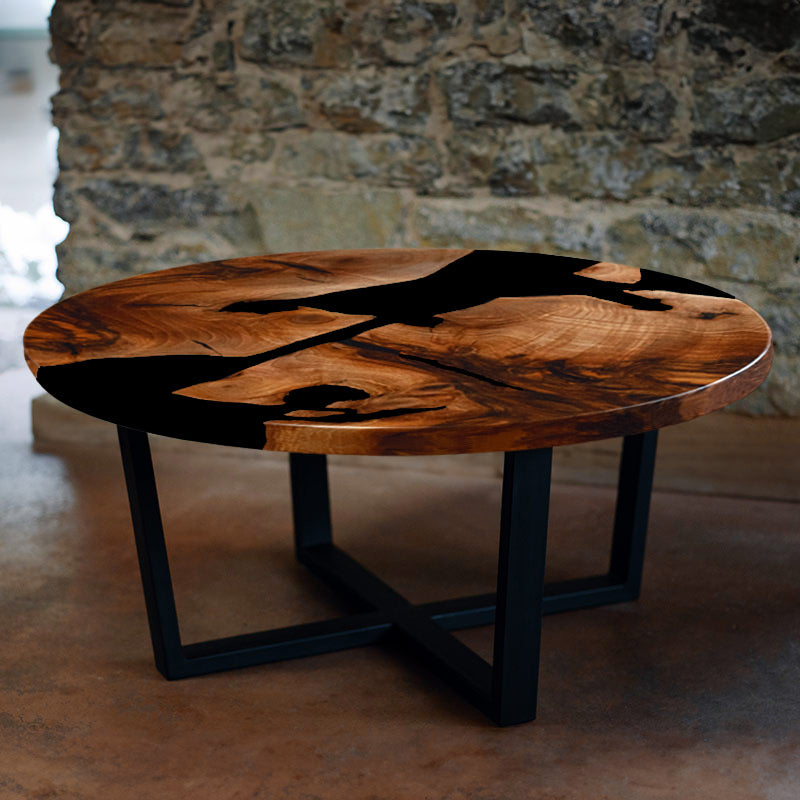 Couchtisch_Epoxidharz. Couchtisch rund aus Nussbaum I Epoxidharz schwarz. Modell Schluchsee