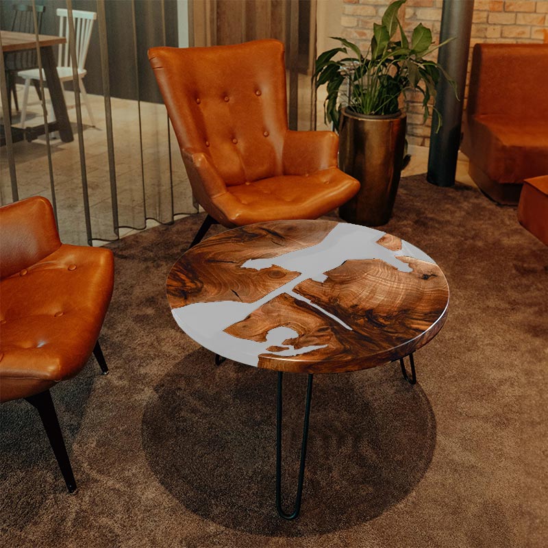 Couchtisch rund aus Nussbaum. Epoxidharz weiss. Modell Schluchsee