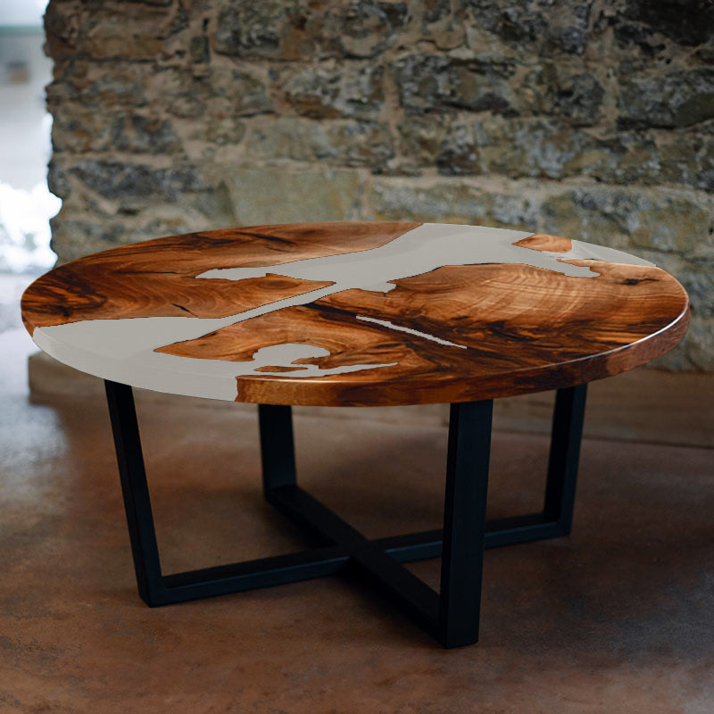 Couchtisch rund aus Nussbaum. Epoxidharz weiss. Modell Schluchsee