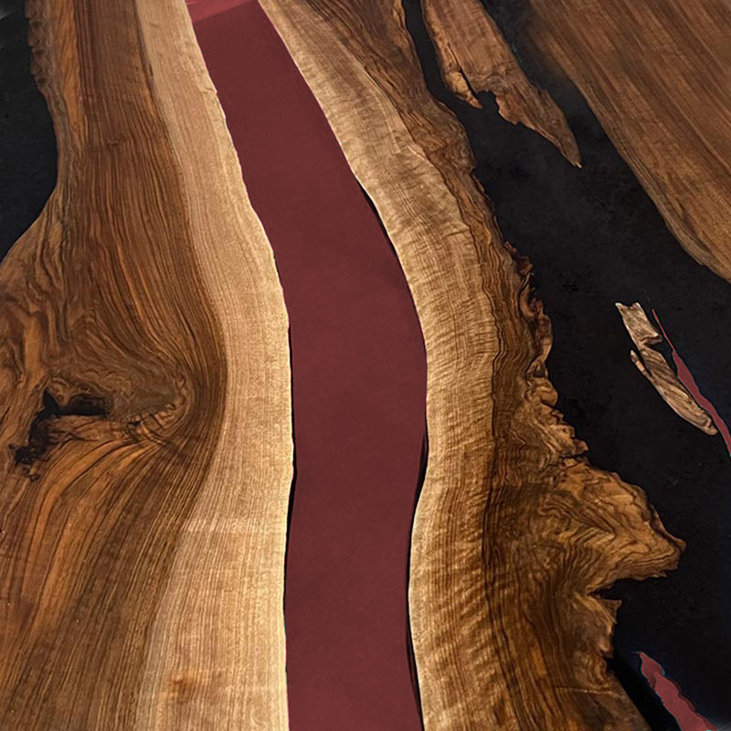 Couchtisch Epoxidharz. Nussbaum rund mit Epoxidharz weinrot. Modell Gletschersee