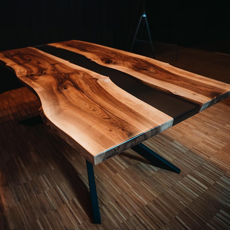 River Table. Epoxidharz Tisch aus Nussbaum mit anthrazitfarbenem Epoxidharz. Modell Schwarzwälder Kirsch von schwarzhirsch